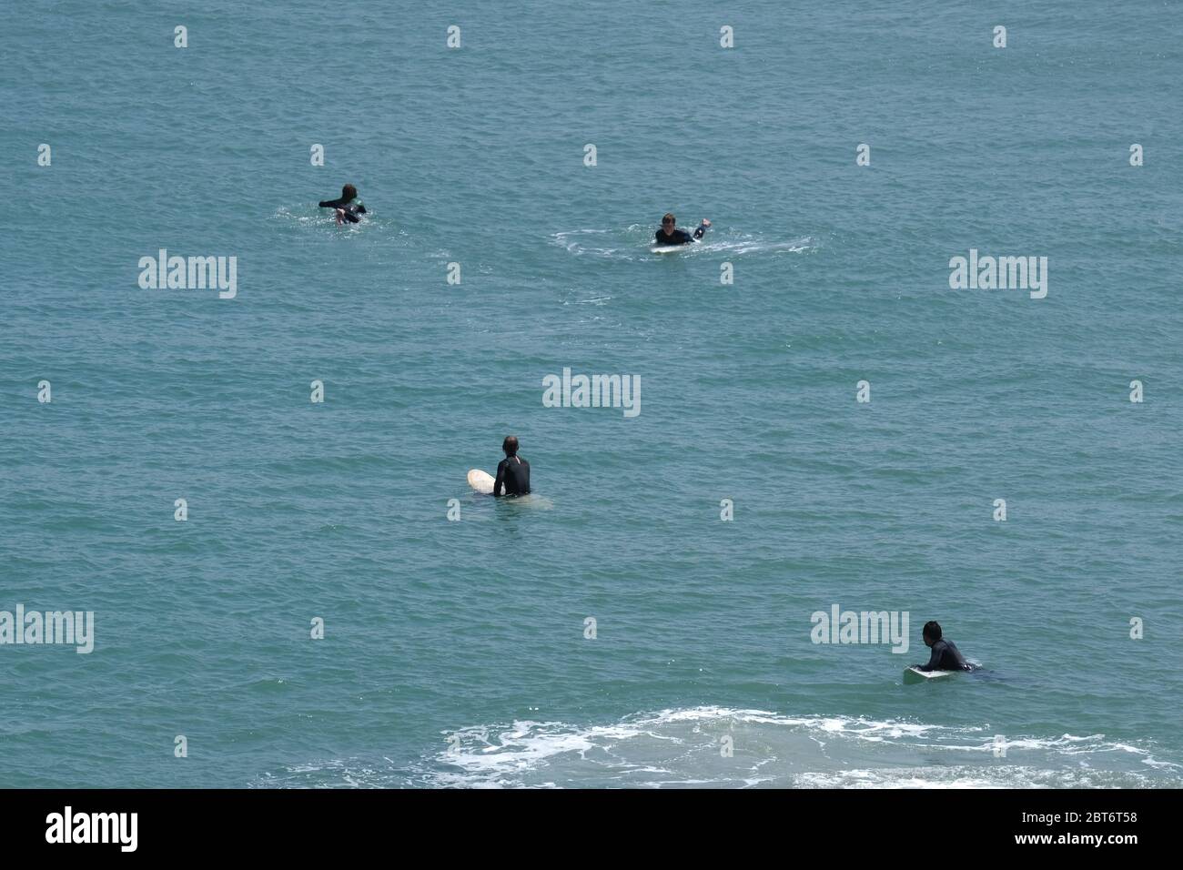 Harlyn Bay, near Padstow, Cornwall, UK. 23rd May 2020. UK Weather. The beach was relatively quiet at Harlyn Bay this afternoon, with walkers and surfers out enjoying the sunny start to the bank holiday weekend. Credit CWPIX / Alamy Live News. Stock Photo