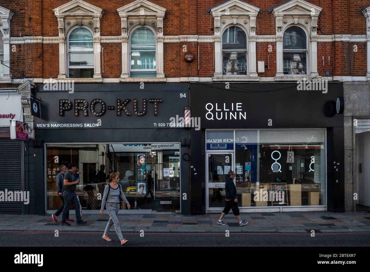 London, UK. 23rd May, 2020. People pass unawares after JK Rowling