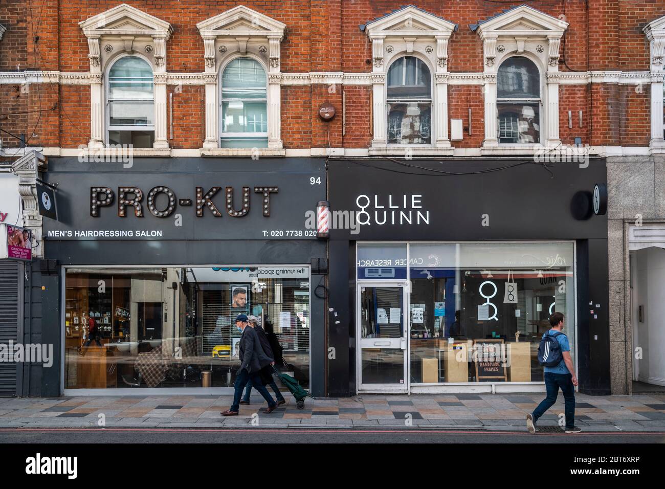 London, UK. 23rd May, 2020. People pass unawares after JK Rowling
