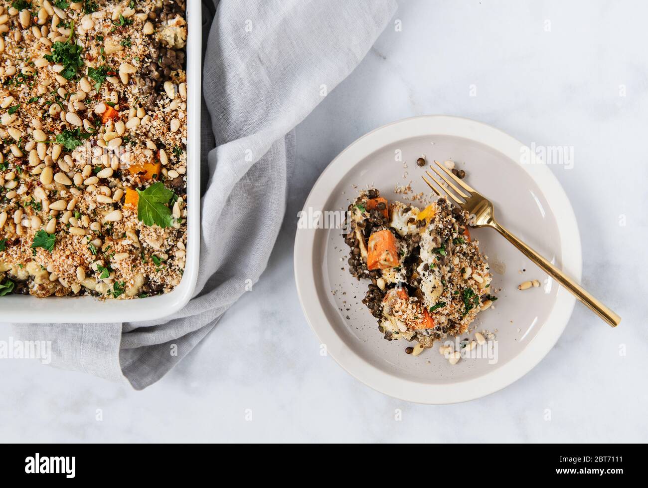Lentil vegetable Casserole with herbs and pine nuts Stock Photo