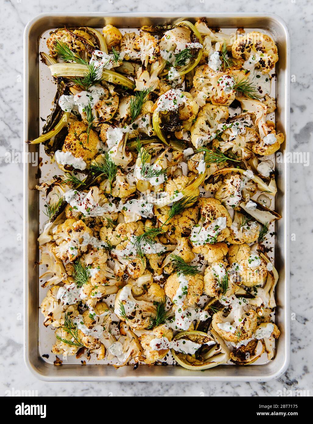 Roasted Cauliflower with Tahini, greek yogurt and spices Stock Photo