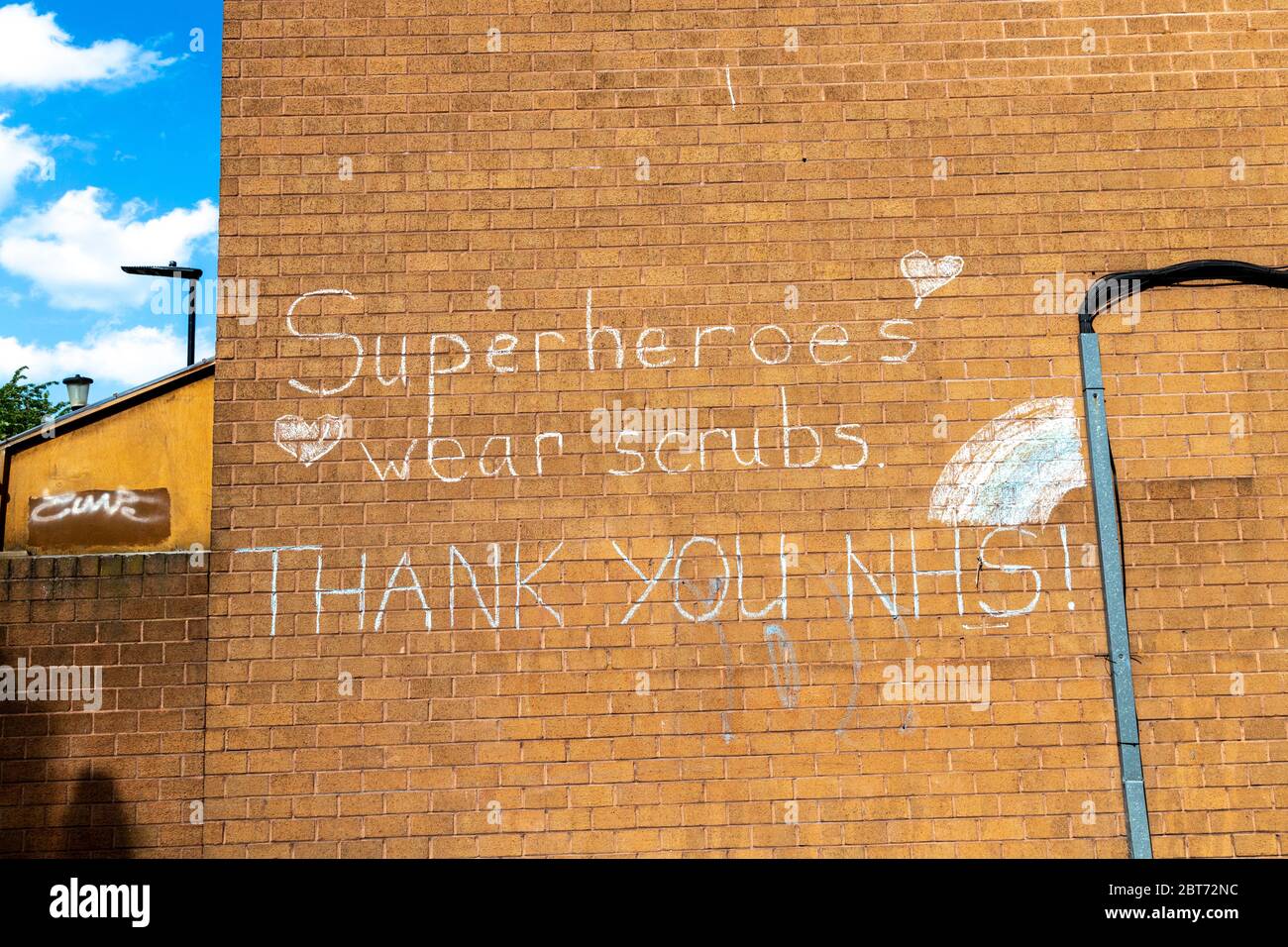 22 May 2020 London, UK - A message on a council estate block in Dalston, Hackney to support the NHS workers during the Coronavirus pandemic outbreak 'Superheroes wear scrubs, Thank you NHS!' Stock Photo