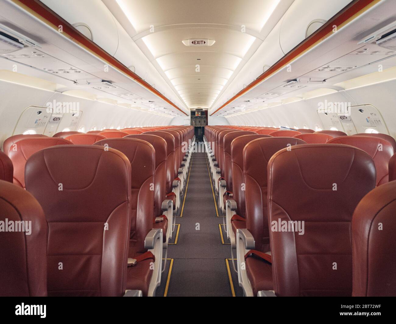 Empty interior cabin of an Airbus A320 Neo with red seats and trim. Many  airlines face dire straits as they face a worldwide shutdown of travel due  to Stock Photo - Alamy