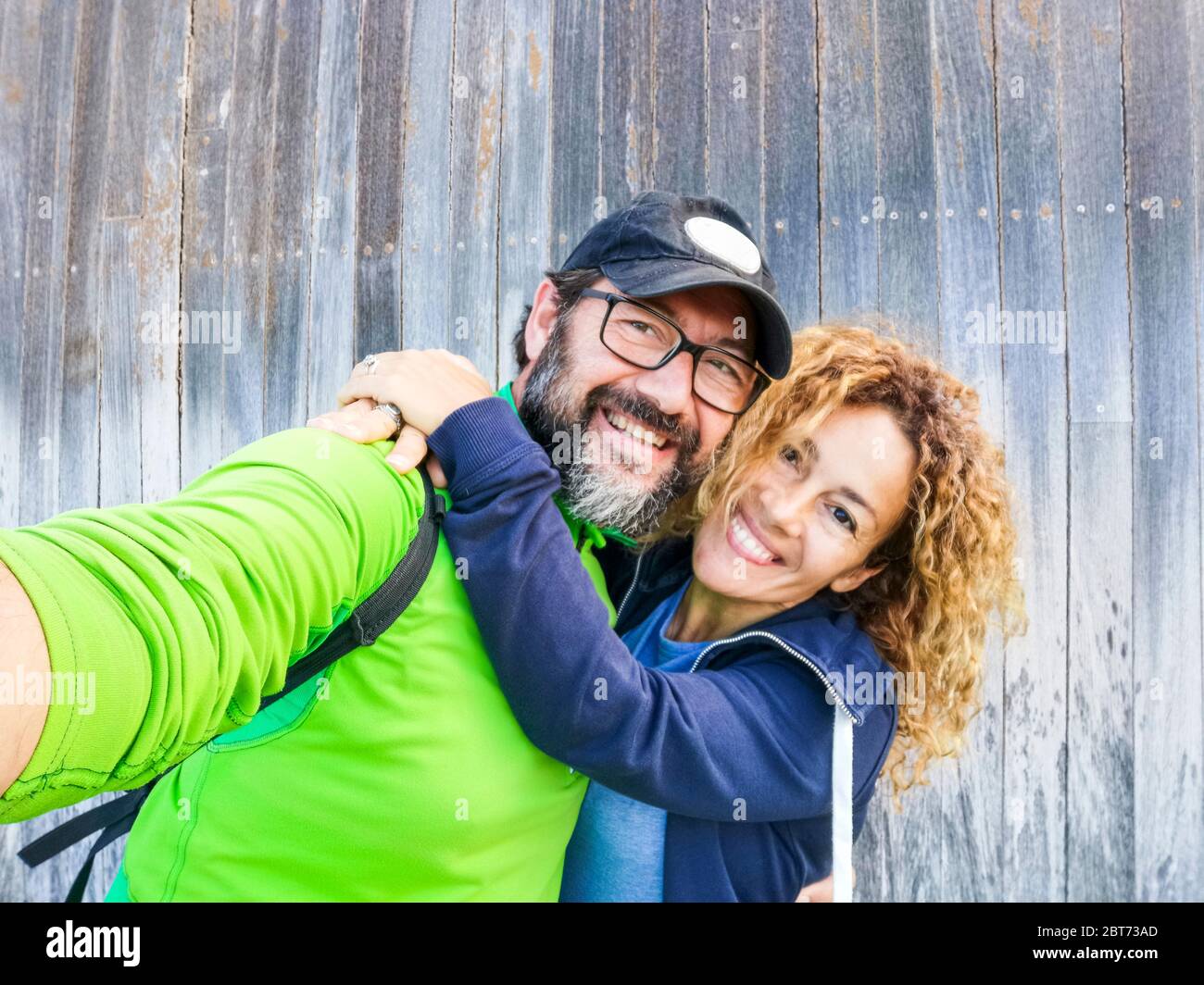 Happy caucasian adult couple in outdoor leisure  activity together taking selfie picture - concept of life and relationship Stock Photo