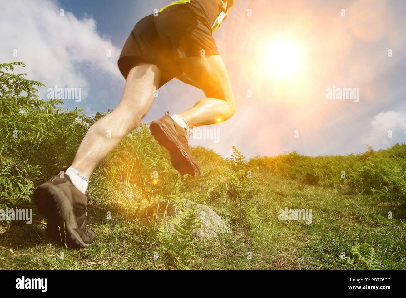 Man hiking in countryside, low section Stock Photo