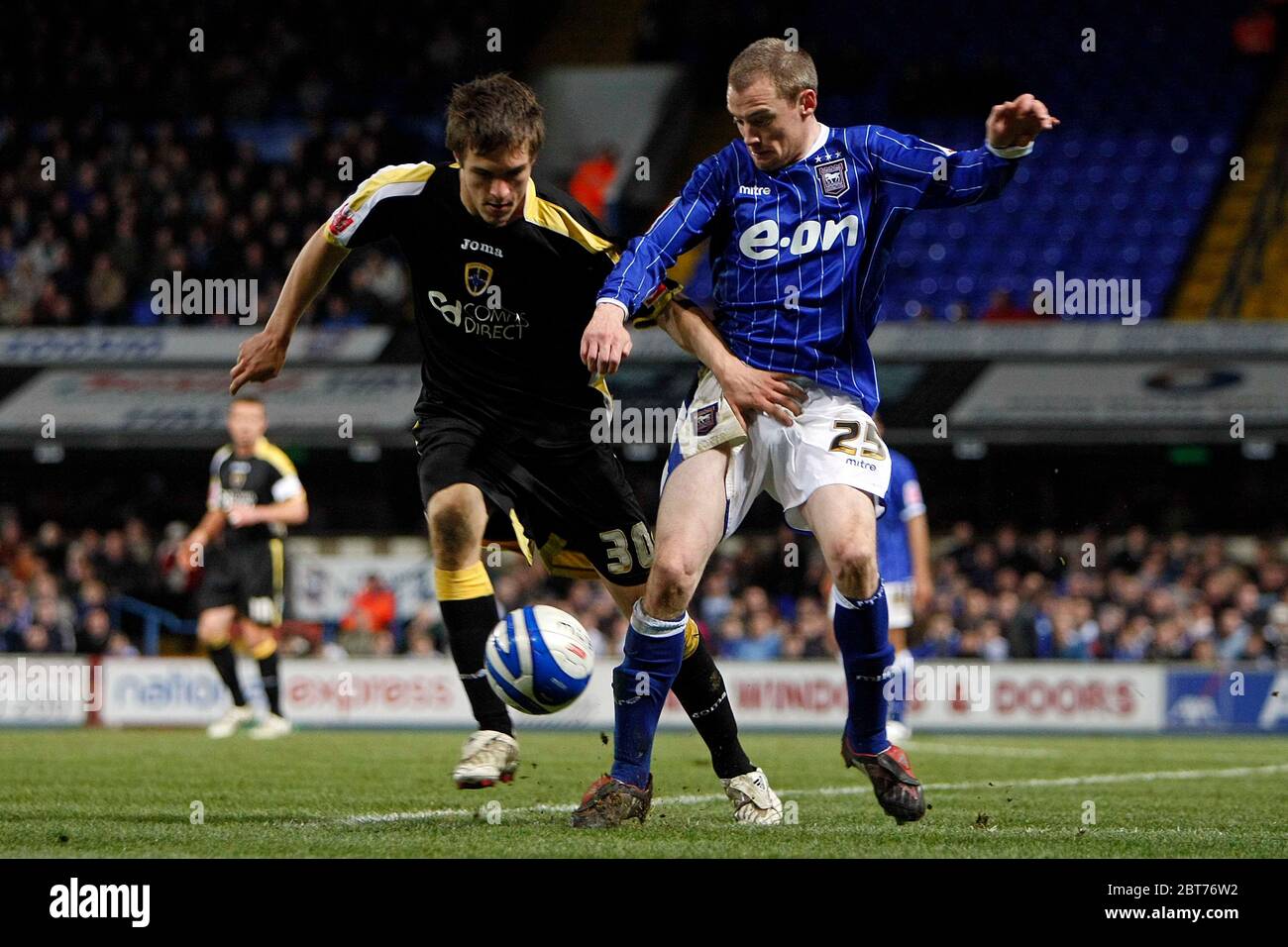IPSWICH, UK. APRIL 09: Cardiff's Aaron Ramsey gets to grips with Ipswich's Alan Quinn  during the Coca Cola Championship between Ipswich Town and Card Stock Photo