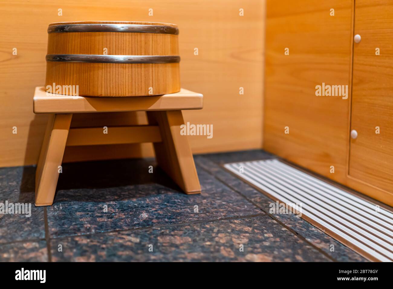 Cypress sauna bathtub wooden traditional Japanese room with water stool in home house or onsen hotel bathroom interior with nobody in Japan Stock Photo