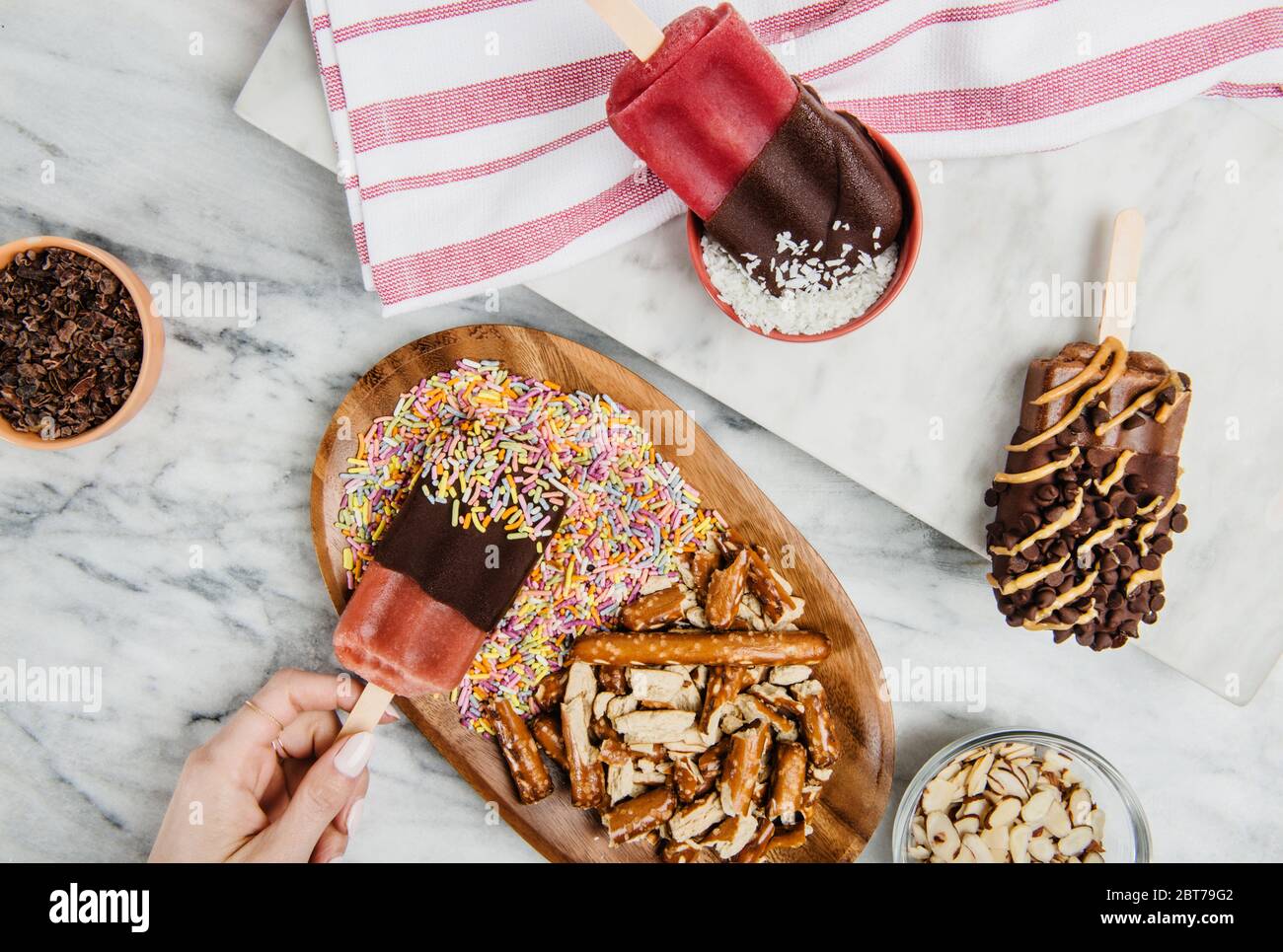 Popsicles dipped in chocolate, coconut and sprinkles Stock Photo