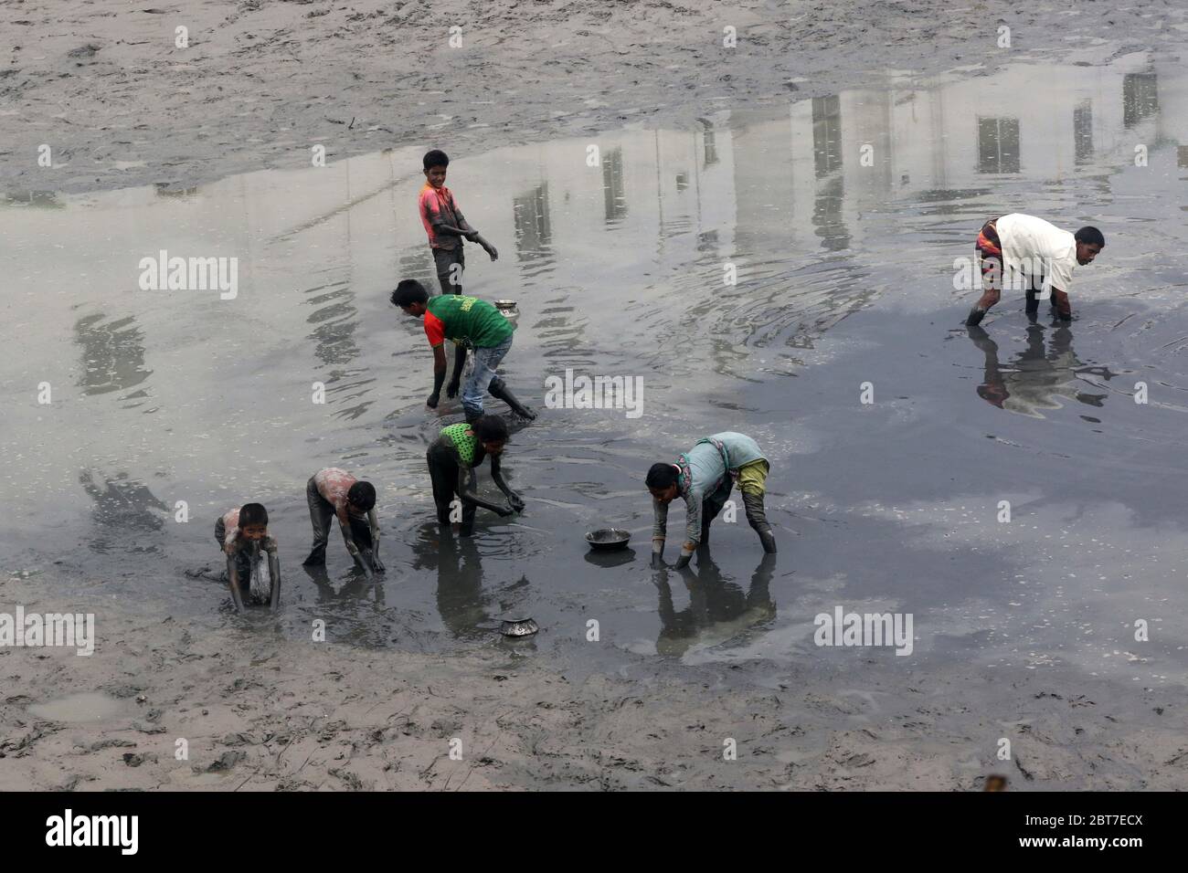 Dhaka 23 April 2015. Local people catching fish in a river at savar in Dhaka.photo by leadfoto Stock Photo