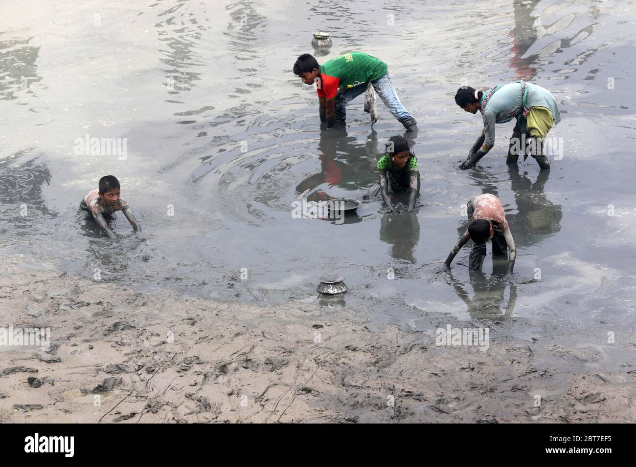 Dhaka 23 April 2015. Local people catching fish in a river at savar in Dhaka.photo by leadfoto Stock Photo