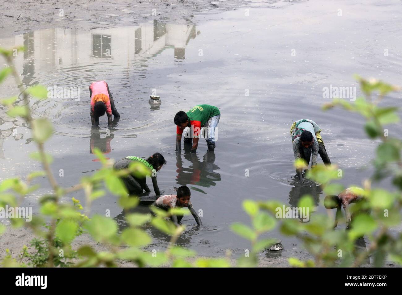 Dhaka 23 April 2015. Local people catching fish in a river at savar in Dhaka.photo by leadfoto Stock Photo