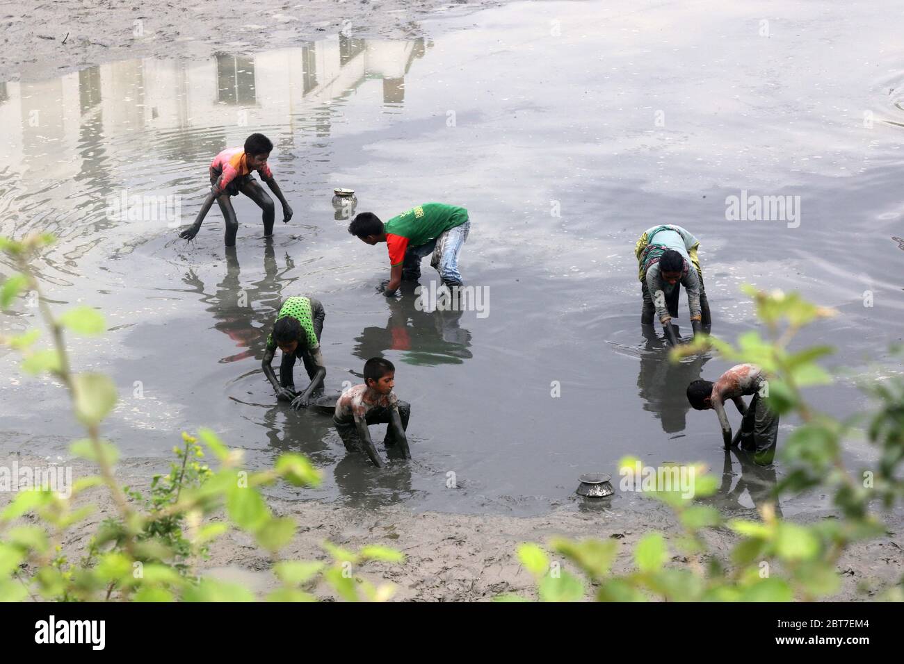 Dhaka 23 April 2015. Local people catching fish in a river at savar in Dhaka.photo by leadfoto Stock Photo