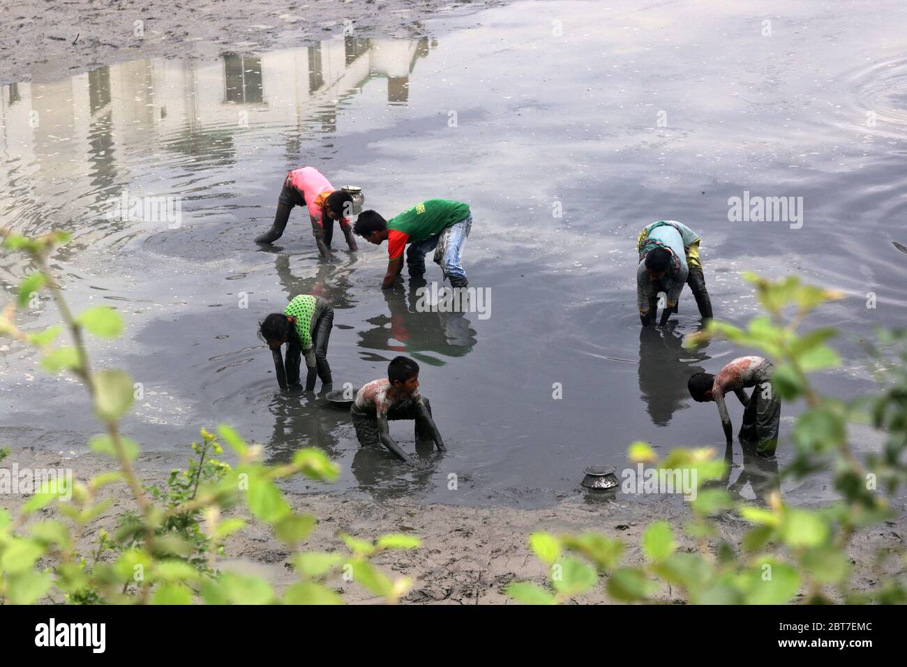 Dhaka 23 April 2015. Local people catching fish in a river at savar in Dhaka.photo by leadfoto Stock Photo