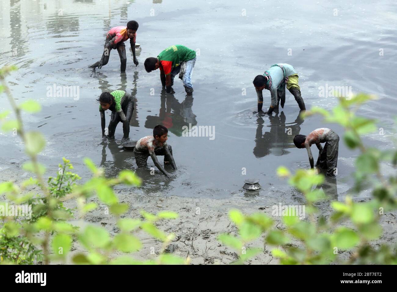 Dhaka 23 April 2015. Local people catching fish in a river at savar in Dhaka.photo by leadfoto Stock Photo