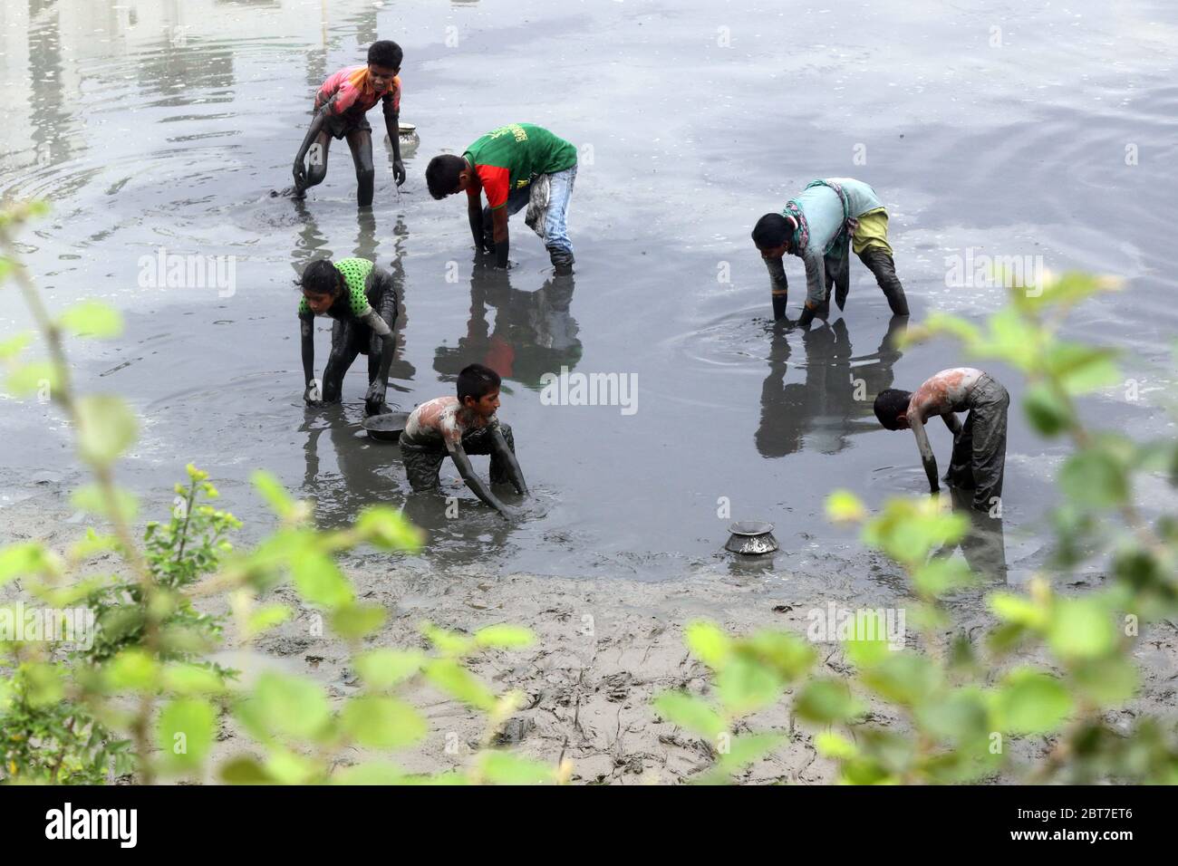 Dhaka 23 April 2015. Local people catching fish in a river at savar in Dhaka.photo by leadfoto Stock Photo
