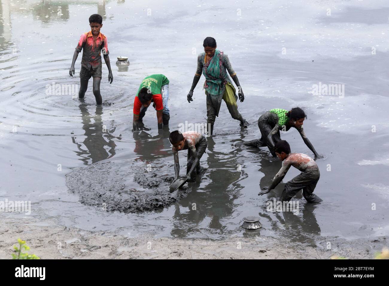 Dhaka 23 April 2015. Local people catching fish in a river at savar in Dhaka.photo by leadfoto Stock Photo