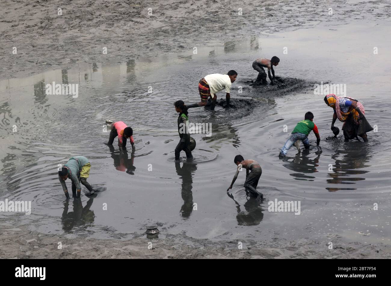 Dhaka 23 April 2015. Local people catching fish in a river at savar in Dhaka.photo by leadfoto Stock Photo