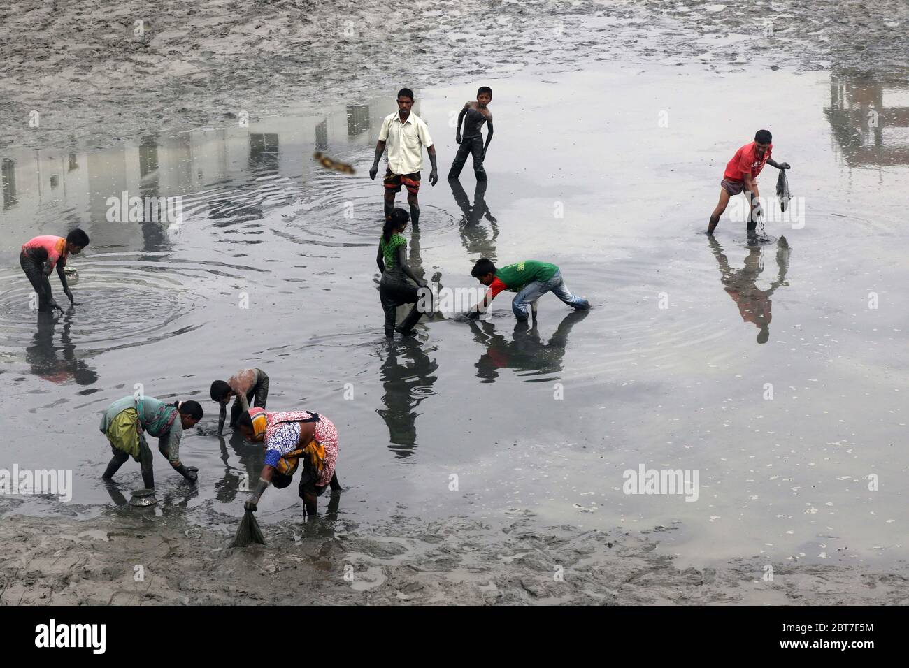 Dhaka 23 April 2015. Local people catching fish in a river at savar in Dhaka.photo by leadfoto Stock Photo