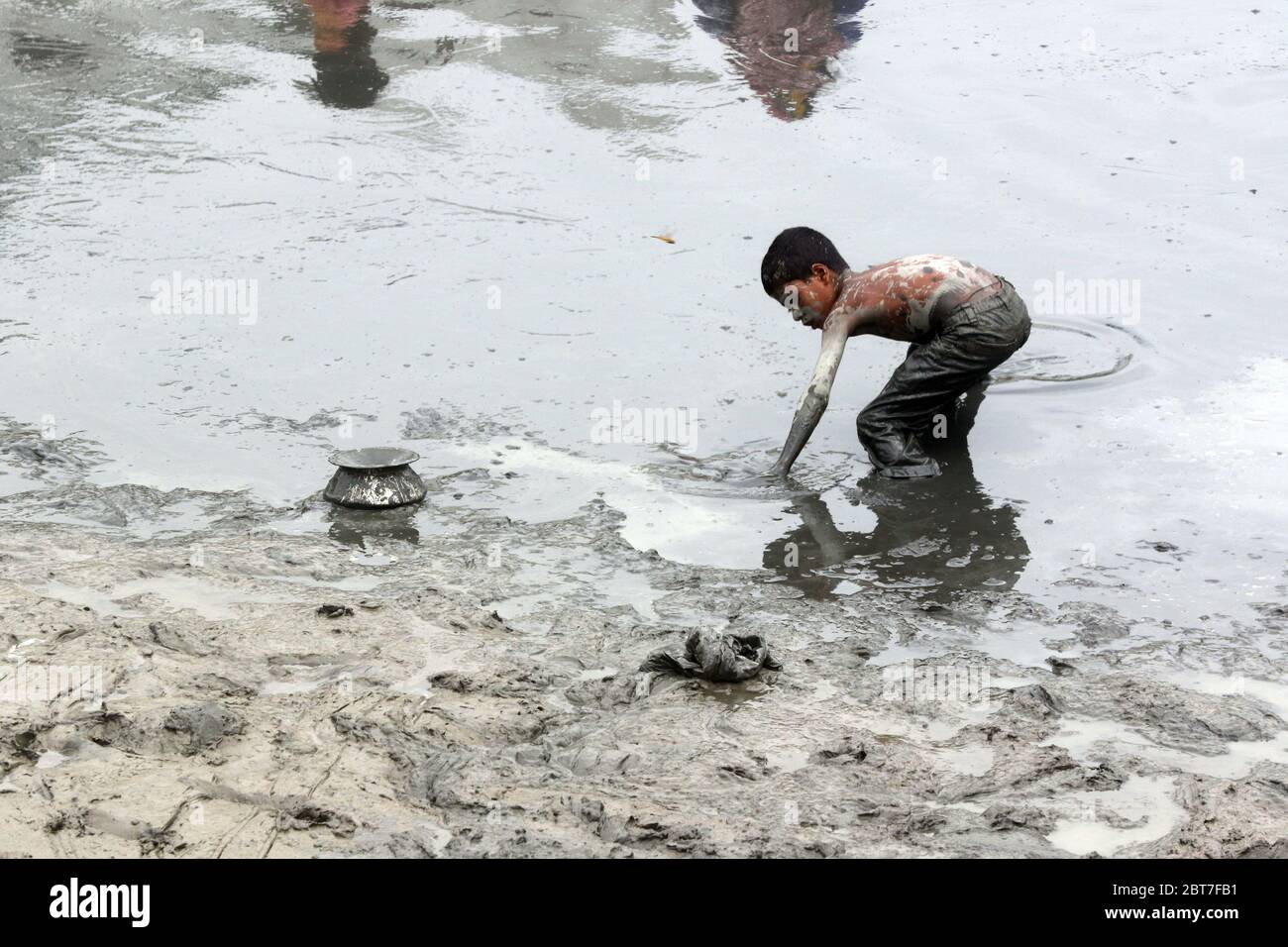 Dhaka 23 April 2015.A village boy catching fish in a river at savar in Dhaka.photo by leadfoto Stock Photo