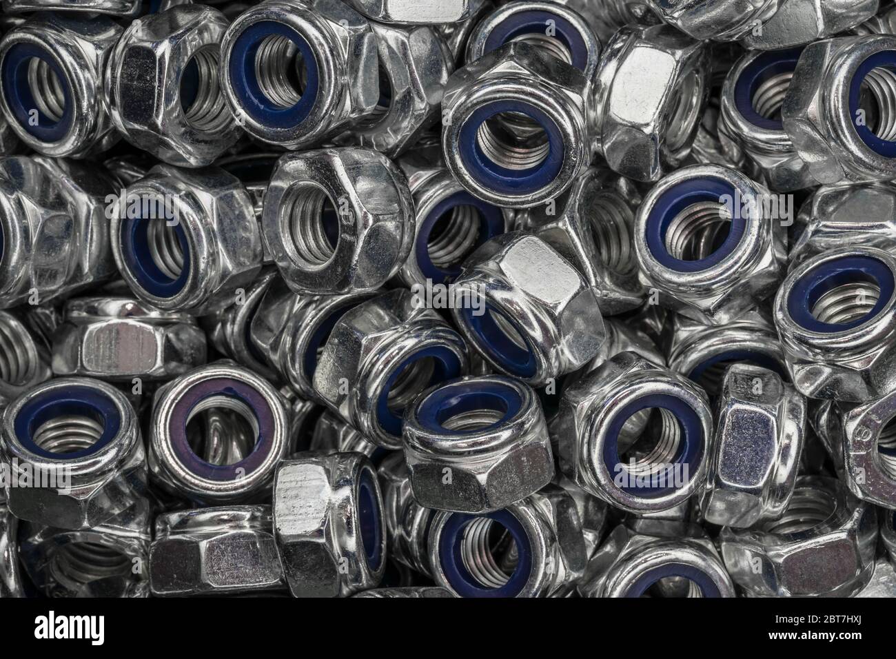 abstract background from hexagonal screw nuts Stock Photo
