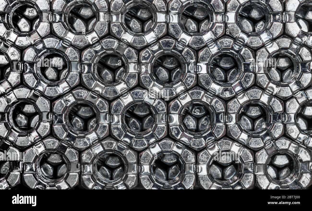 abstract background from hexagonal screw nuts Stock Photo