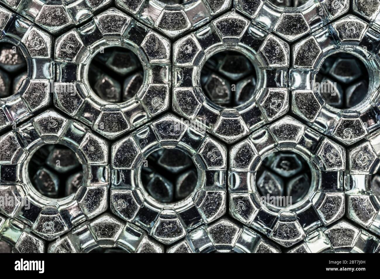 abstract background from hexagonal screw nuts Stock Photo