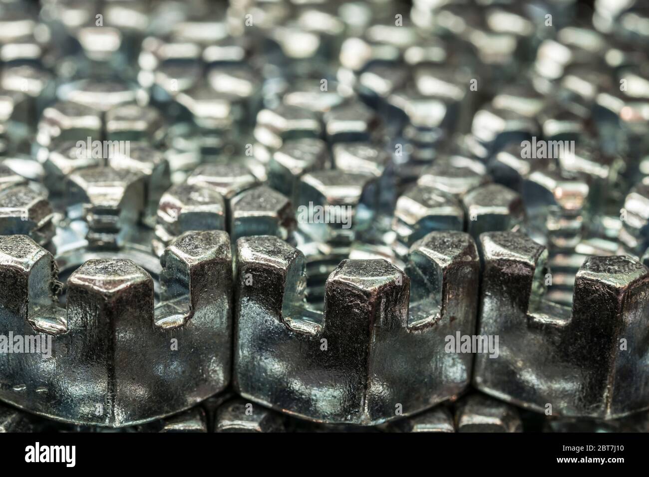 abstract background from hexagonal screw nuts Stock Photo