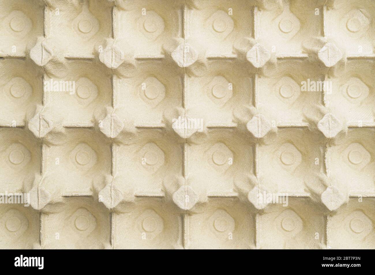 Empty paper packaging for eggs with cells. Abstract background. View from above Stock Photo