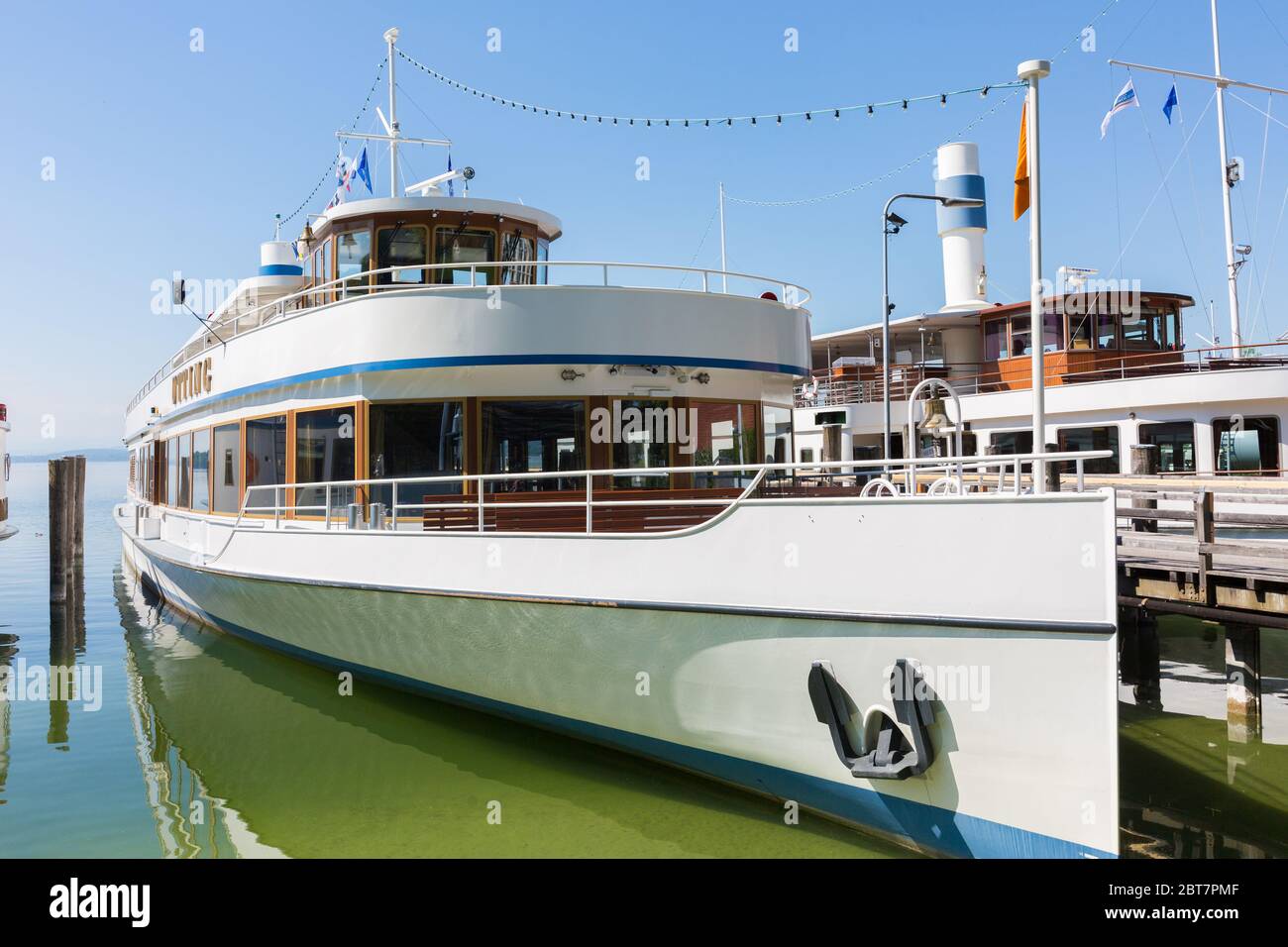 View on a steam boat / steamer anchoring at the pier of Stegen, Lake Ammer. Normally the steamer season starts beg of May; delayed due to the Covid-19 Stock Photo