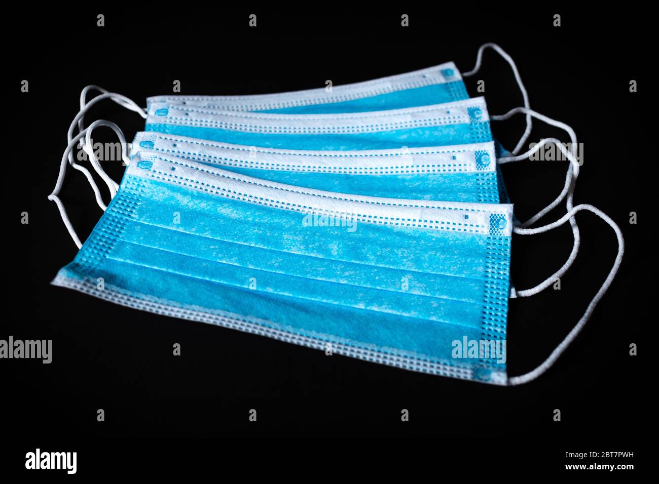 Four black medical masks hi-res stock photography and images - Alamy