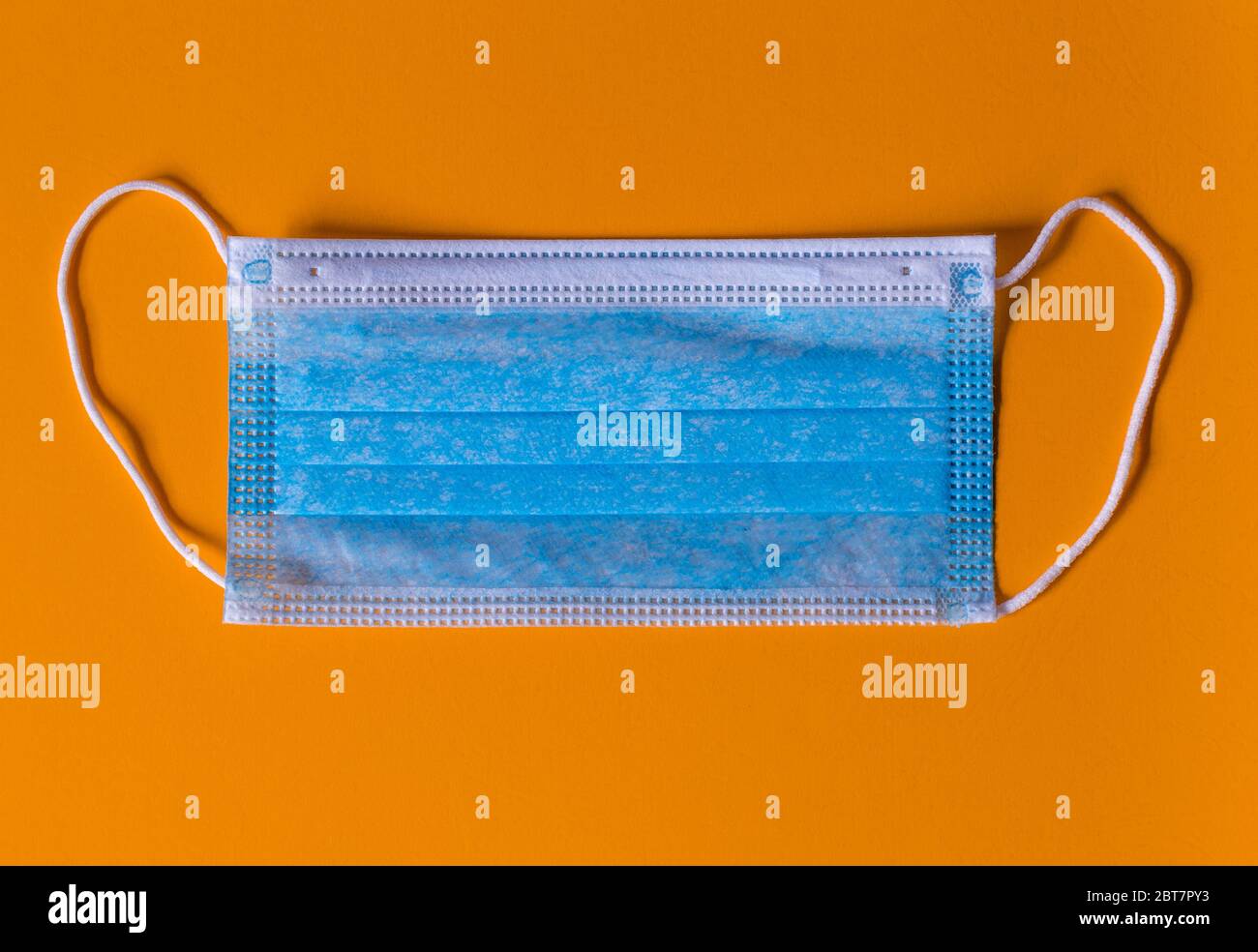 New isolated Medical face mask in an Orange background Stock Photo Alamy