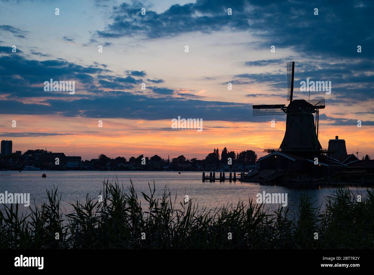 The windmills of Zaanse Schans at dusk, Netherlands Stock Photo
