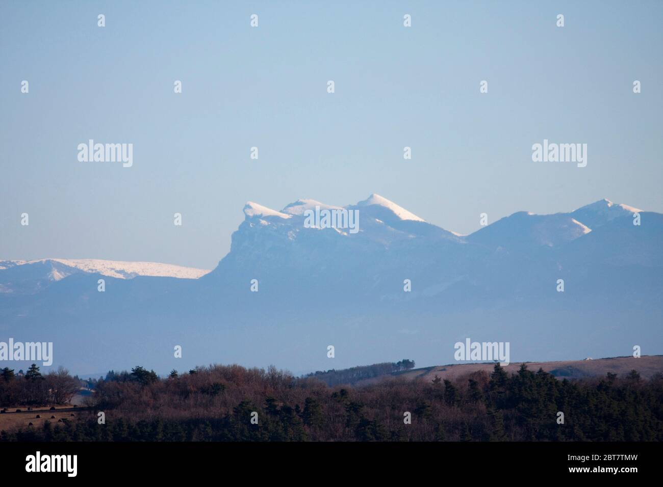 Les Trois Becs mountain range in distance, snow covered peaks, Vercors, Pre-Alpes, France Stock Photo