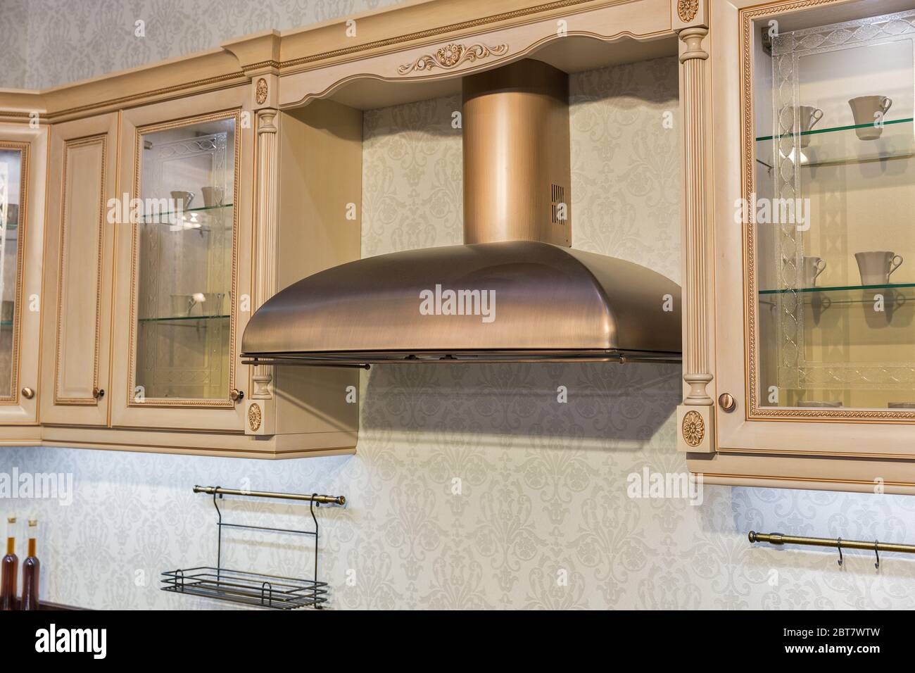 Modern kitchen furniture interior with cooker hood in antique style Stock Photo