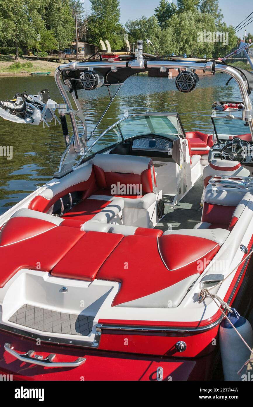 Luxury speed boat moored on a sunny day with wakeboard mount Stock Photo