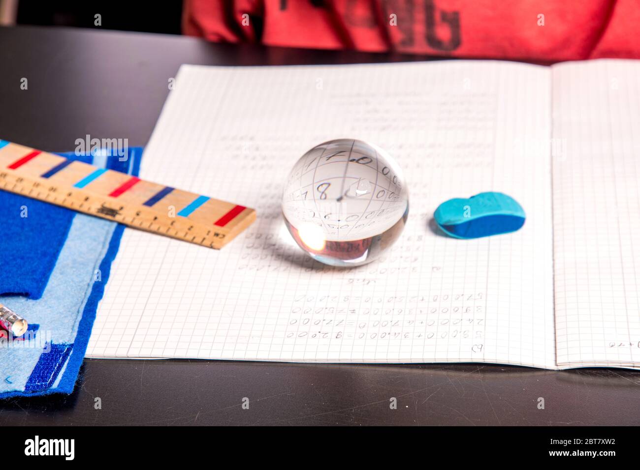 Crystal Ball Math Problem Student with crystal ball on his math notebook before the exam Stock ...