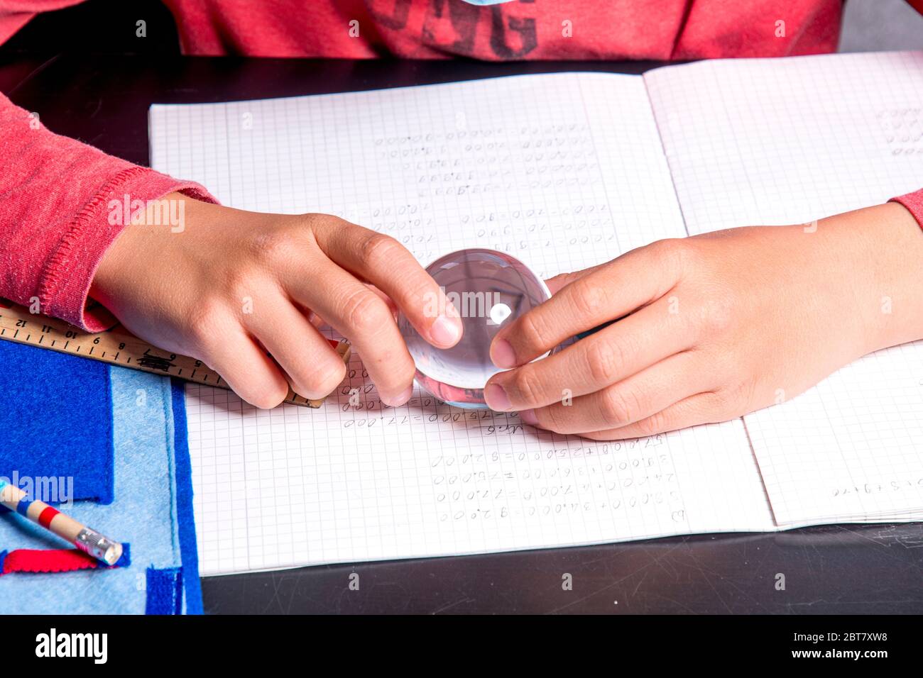 Crystal Ball Math Problem Student with crystal ball on his math notebook before the exam Stock ...