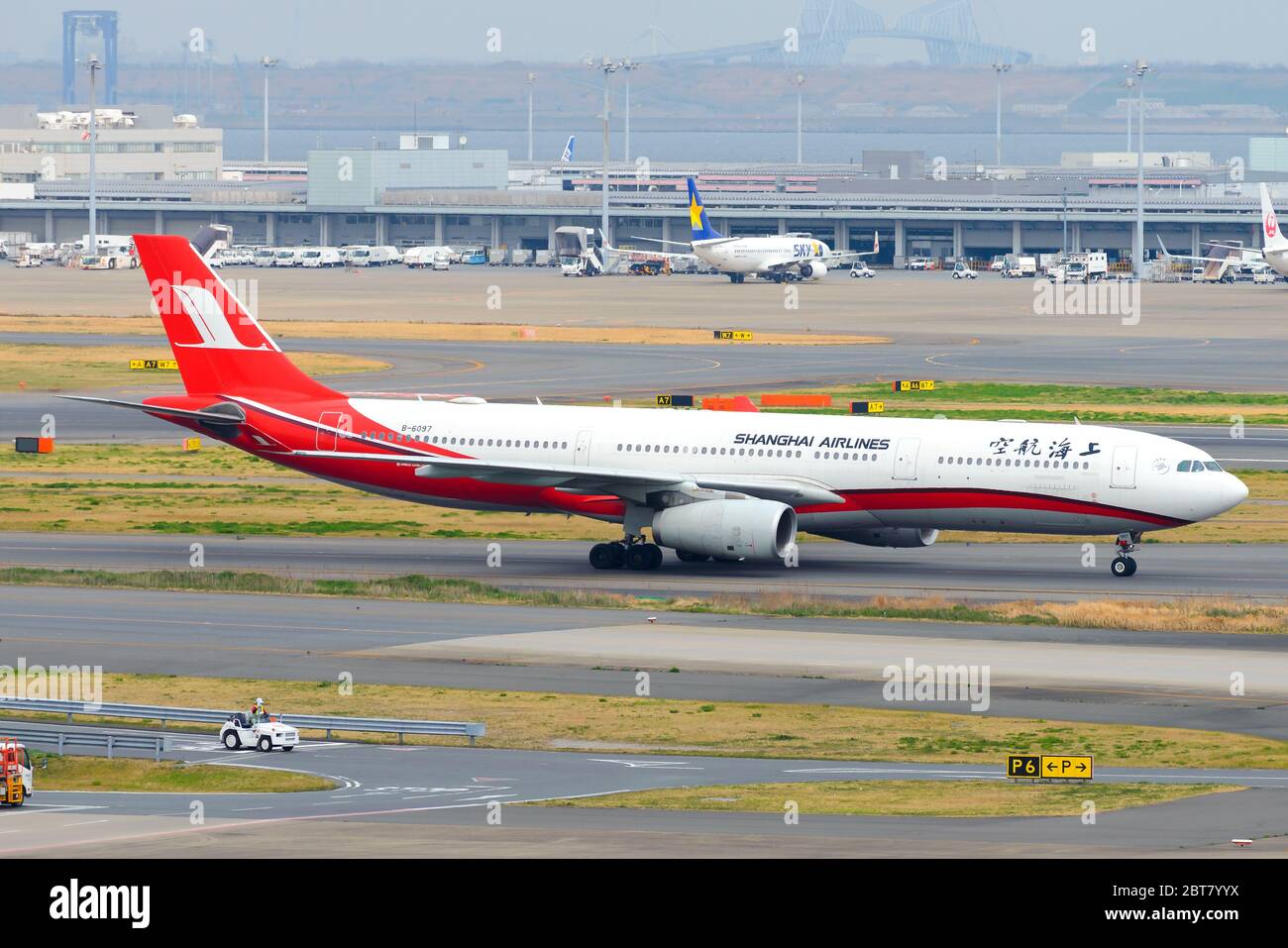 Shanghai Airlines Airbus A330 inbound from Shanghai Pudong Airport. A330-300 B-6097 aircraft taxiing at Haneda International Airport. Chinese airline. Stock Photo