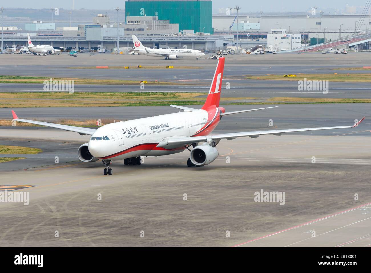 Shanghai Airlines jet Airbus A330 B-6097 inbound from Pudong Airport in China. Aircraft wingspan. Shangai Airlines airplane. Stock Photo