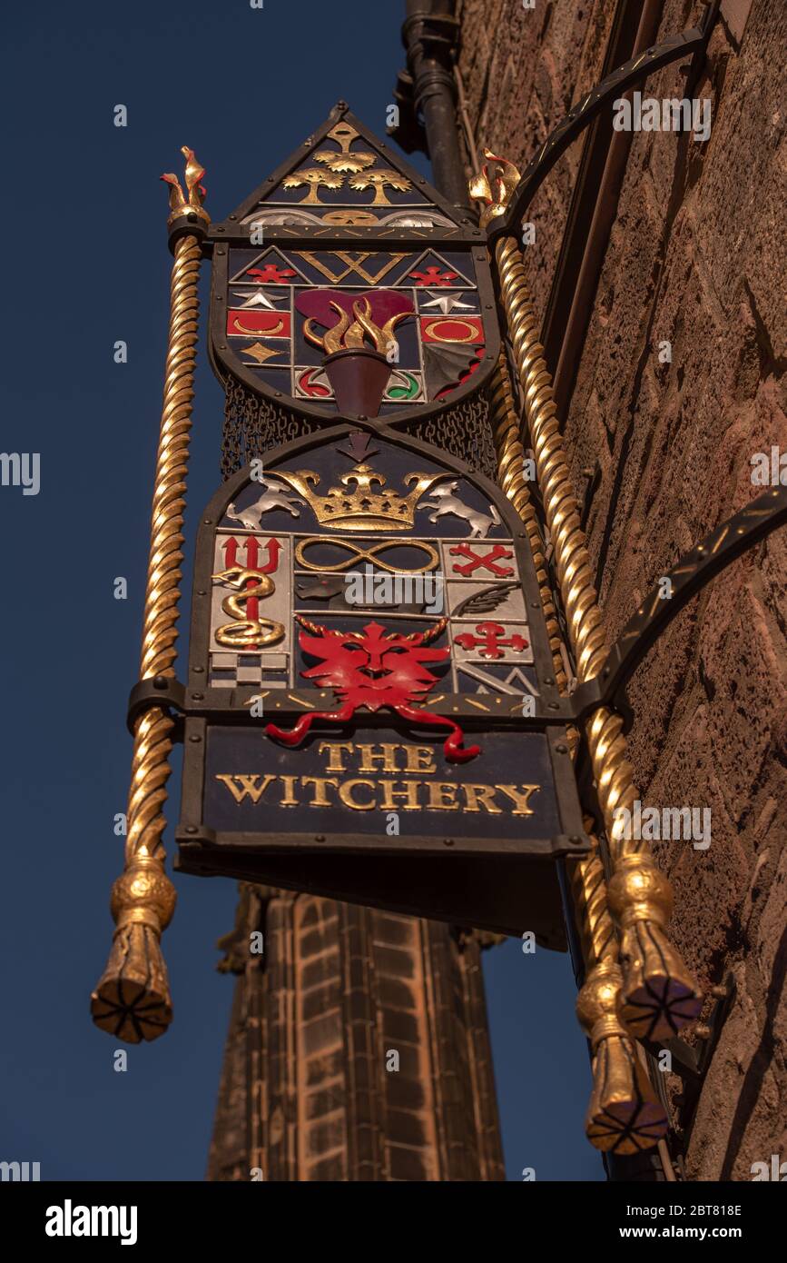 Old fashioned outside sign for the Witchery restaurant by the Castle Edinburgh Stock Photo