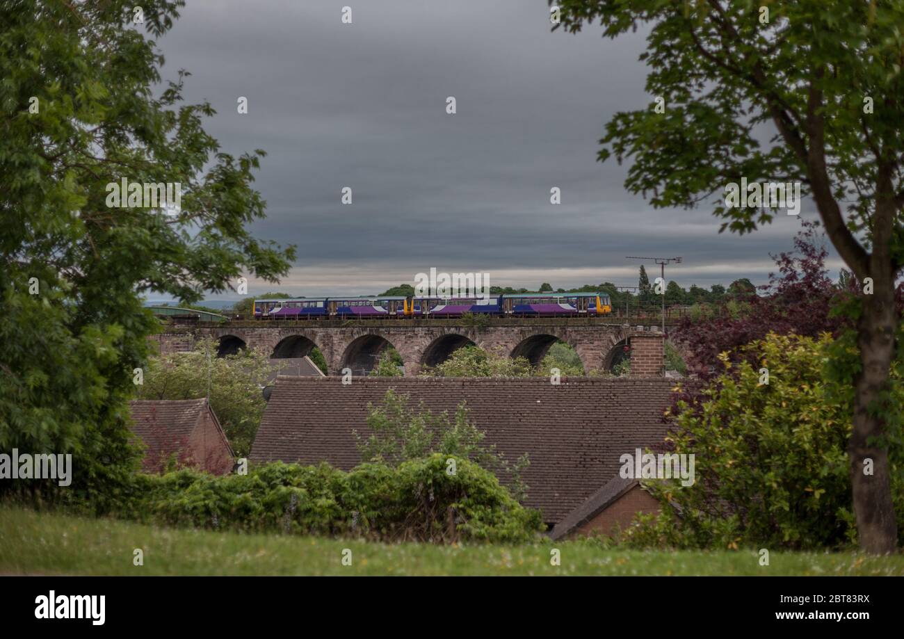 2 Northern rail class 142 pacer trains crossing the viaduct at Northwich on the mid Cheshire line Stock Photo