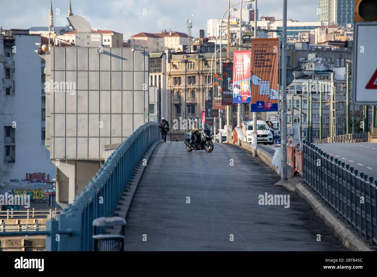 Empty view of the Galata Bridge, is a bridge that spans the Golden Horn, during the curfew on Ramadan. Stock Photo