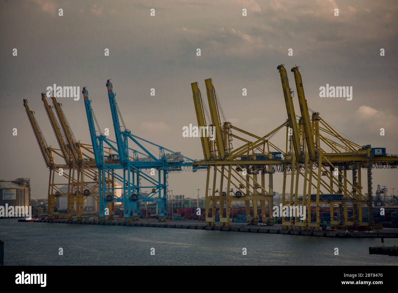 Container cranes at logistics and industrial area of La Zona Franca in Barcelona port. Spain exports more than imports due to the coronavirus crisis, despite the economic impact, the external deficit is expected to experience a historic reduction. Stock Photo