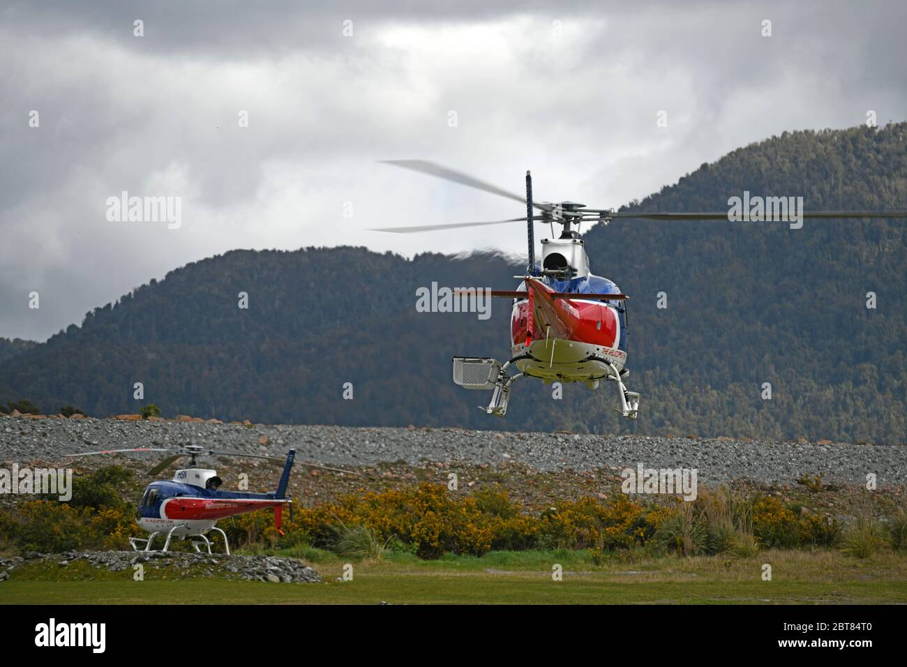 FRANZ JOSEF, NEW ZEALAND, OCTOBER 5, 2019; Tourist helicopters operating at Franz Josef village carry tourists to the world famous glacier in the Sout Stock Photo