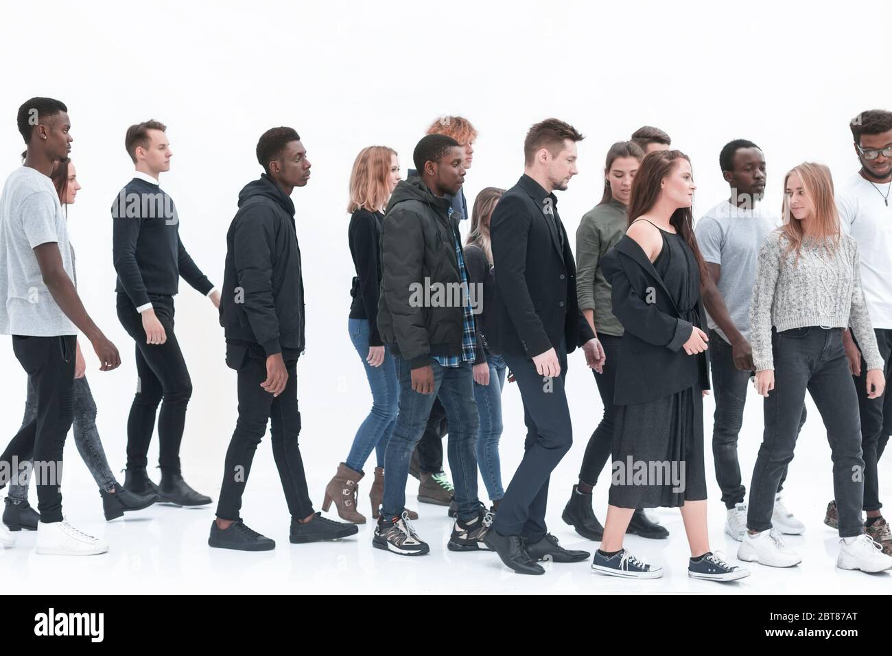 group of diverse young people walking in one direction Stock Photo - Alamy