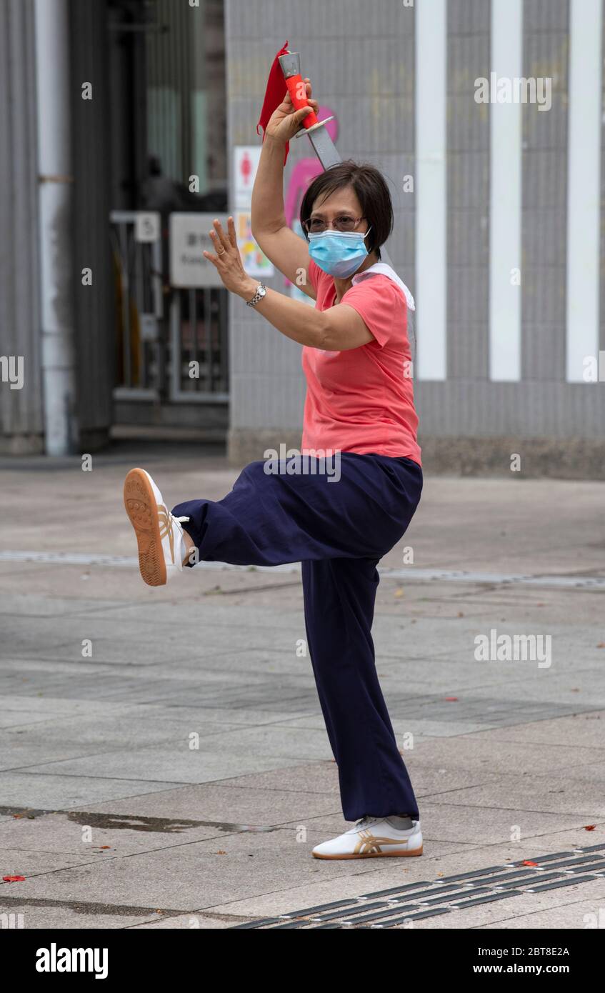 Hong Kong, Hong Kong, China. 24th May, 2020. Ladies in Victoria Park hong Kong practise their Tai Chi sword first thing in the morning.With social distancing loosening, the parks are filling up with people keen to get some exercise. Credit: Jayne Russell/ZUMA Wire/Alamy Live News Stock Photo