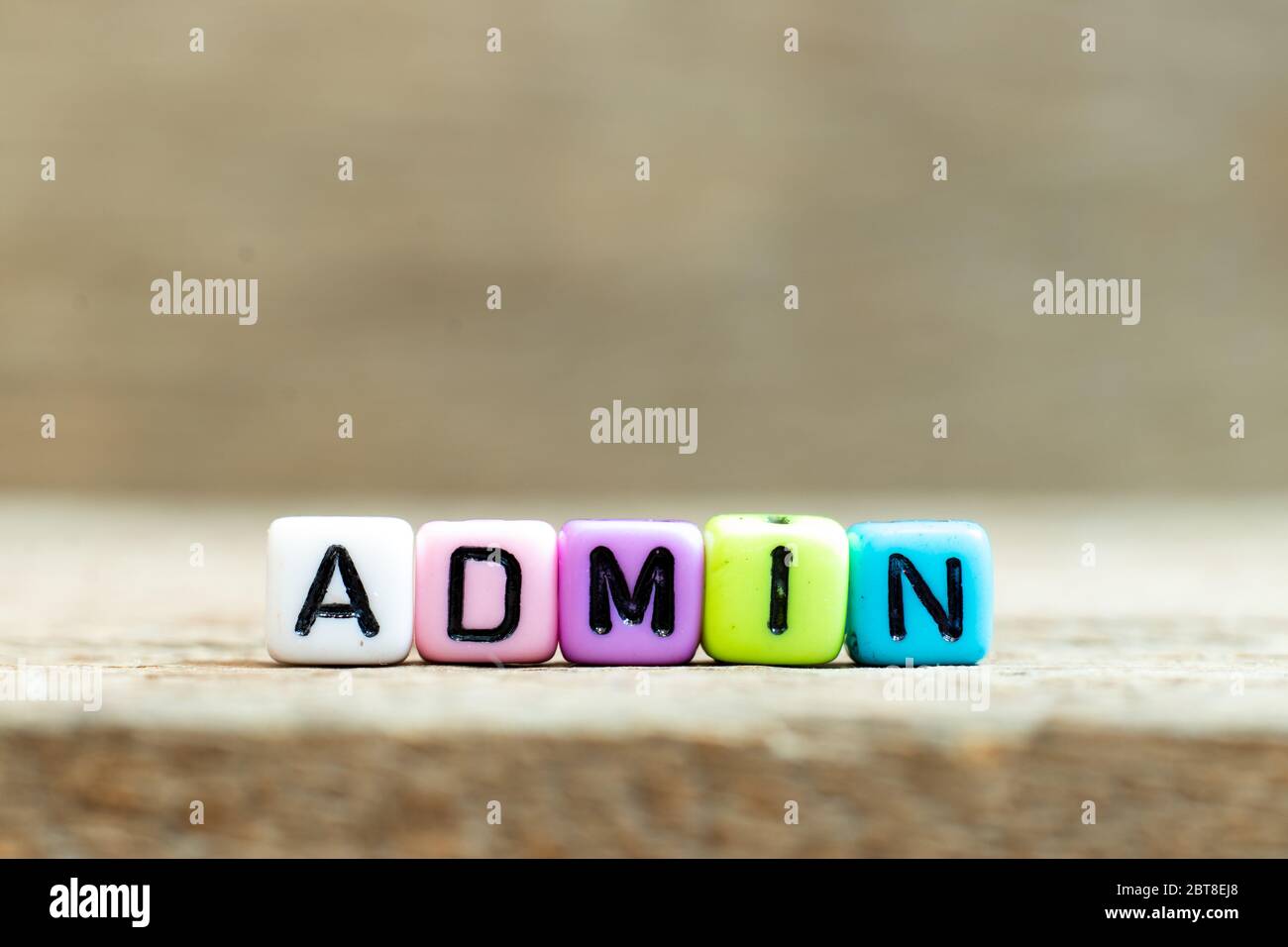 Colorful bead with black letter in word admin (Abbreviation of administration) on wood background Stock Photo