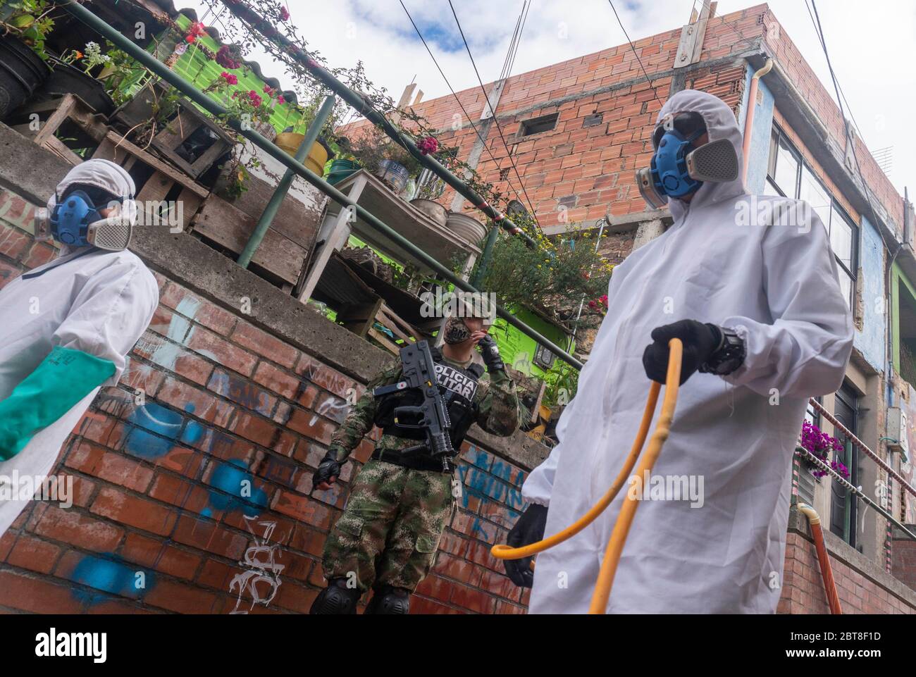 Bogota, Colombia. 23rd May, 2020. Soldiers from the Military Police Battalion during a cleaning, disinfection and spraying session in the La Mariposa Mariposa sector to counter the spread of the corona virus, COVID 19. Credit: Daniel Garzon Herazo/ZUMA Wire/Alamy Live News Stock Photo