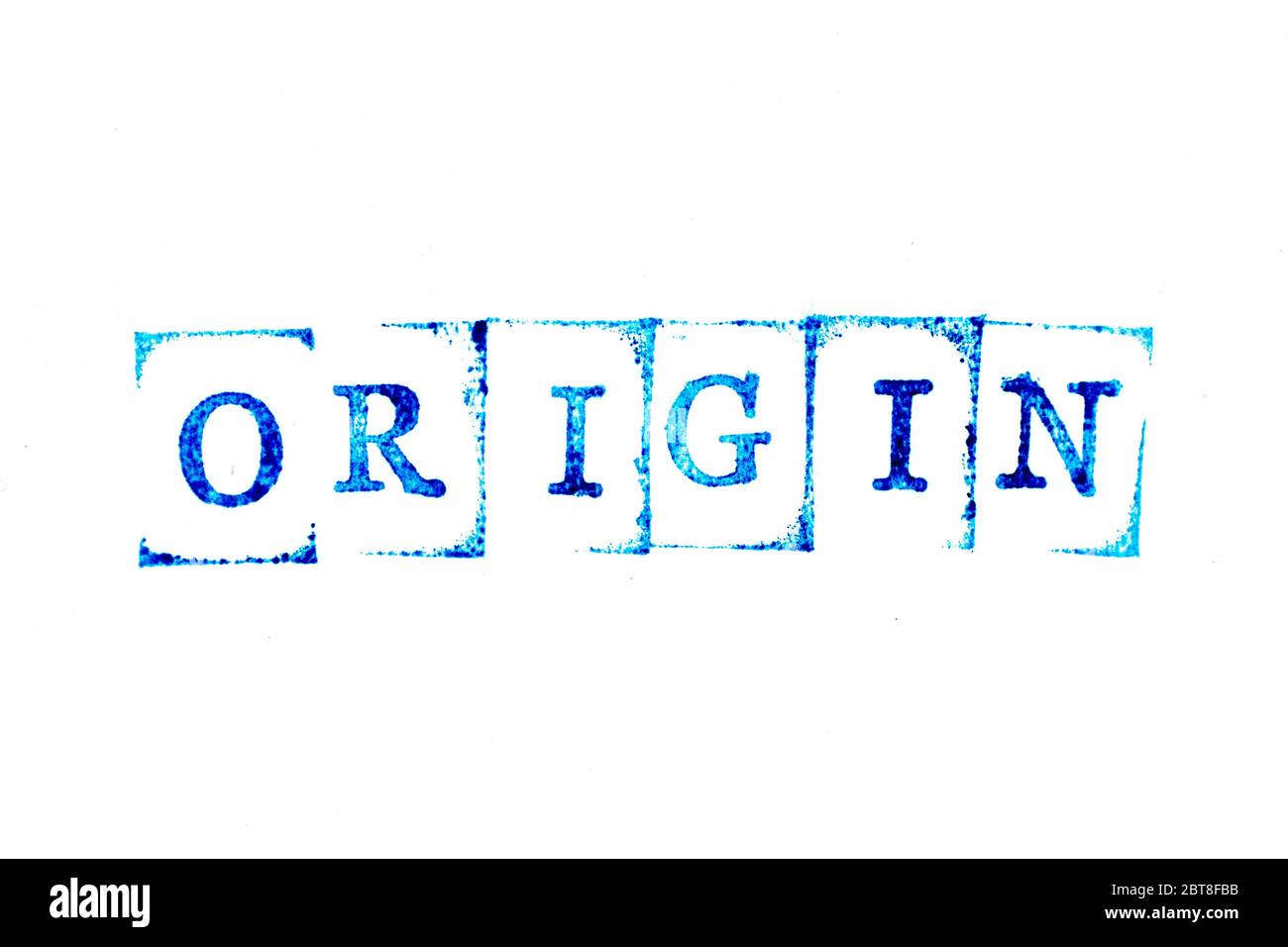 Blue ink of rubber stamp in word origin on white paper background Stock