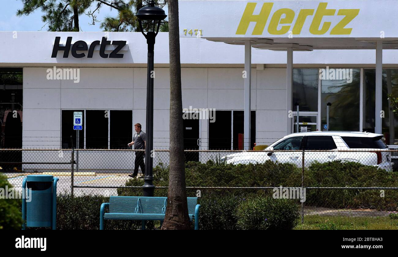 A Hertz car rental office is seen the day after Hertz announced it was filing for bankruptcy due to a sudden decline in the company's revenue caused by a dramatic decrease in travel during the COVID-19 pandemic. The company intends to restructure its debts and remain in business. Stock Photo